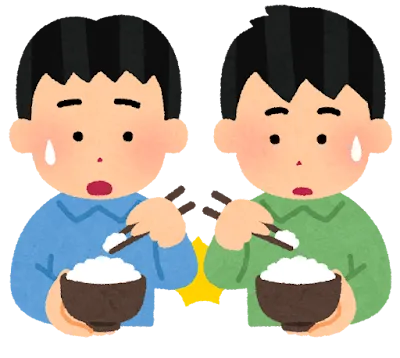 左利きの人と右利きの人が並んでごはんを食べる