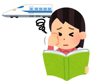 新幹線の乗車中に読書をする女性